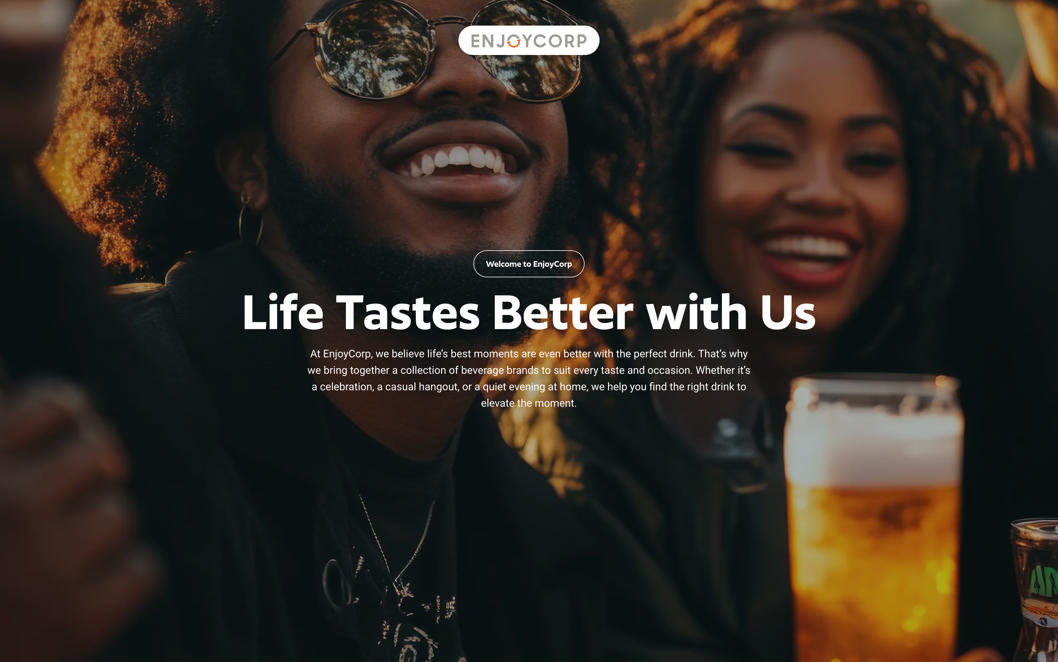EnjoyCorp hero: “Life Tastes Better with Us” over a warm photo of friends laughing at golden hour, one in sunglasses, a glass of beer in the foreground and the EnjoyCorp wordmark above.